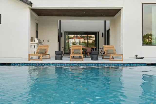 a view of living room with furniture and floor to ceiling window