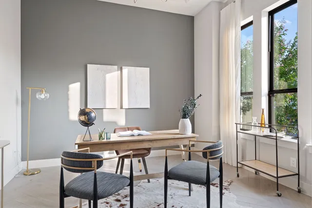 a view of a dining room with furniture window and outside view