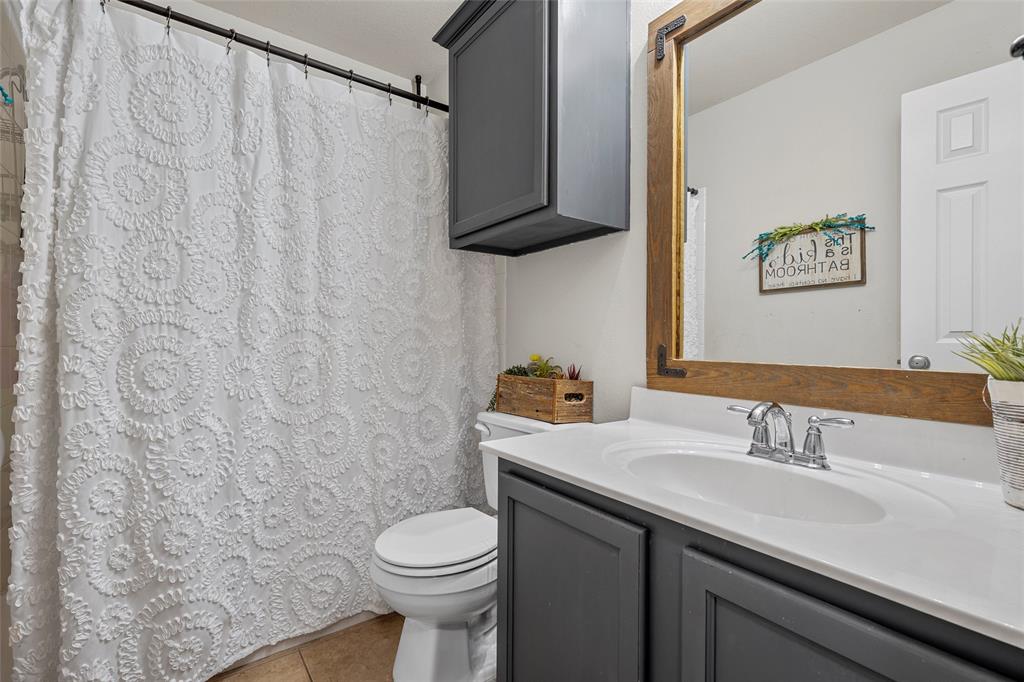 6725 Cold Water Drive Waco, TX 76712 - Photo 11 of 19 a bathroom with a sink and a toilet