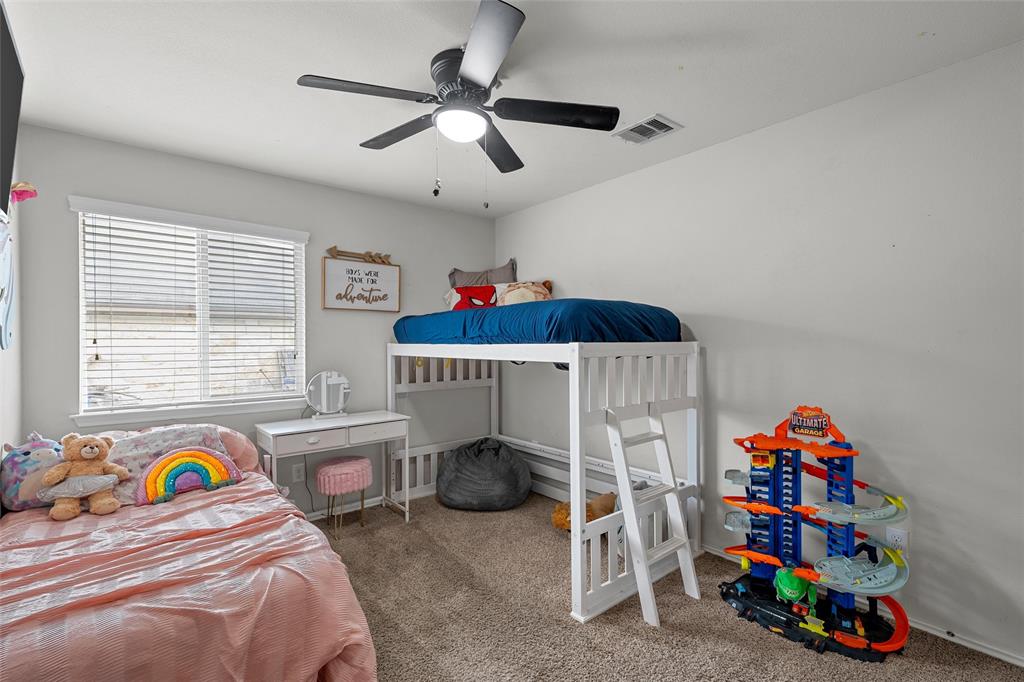 6725 Cold Water Drive Waco, TX 76712 - Photo 12 of 19 a bedroom with a bed and a window
