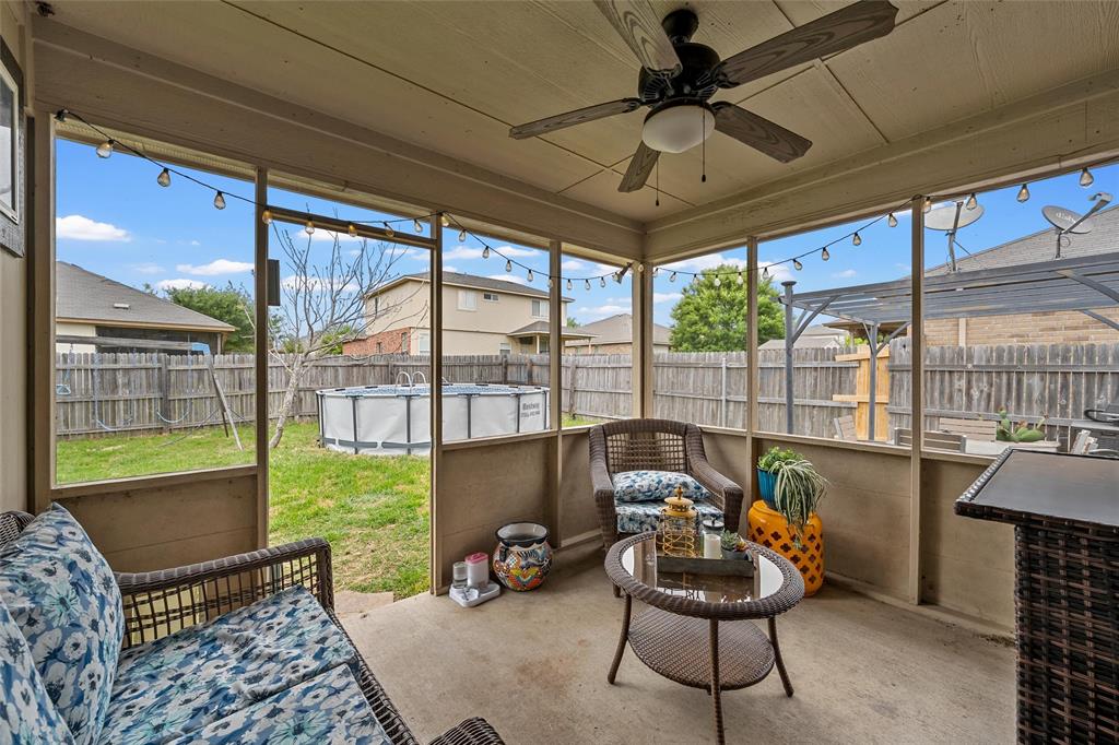 6725 Cold Water Drive Waco, TX 76712 - Photo 13 of 19 a living room with furniture and a floor to ceiling window