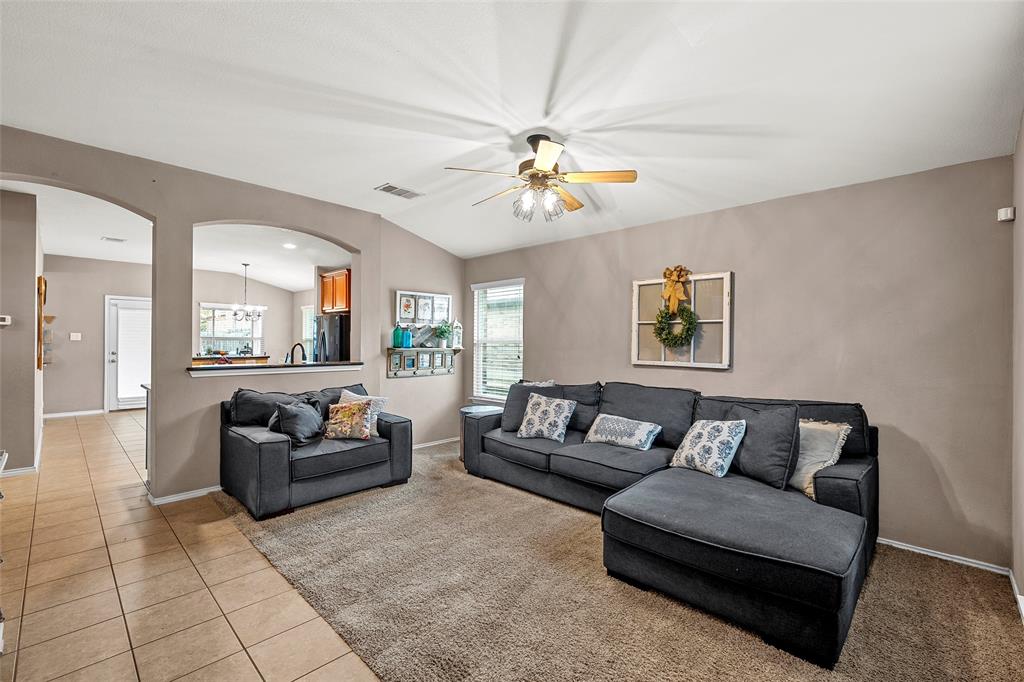 6725 Cold Water Drive Waco, TX 76712 - Photo 3 of 19 a living room with furniture and a chandelier