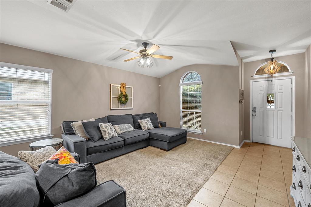 6725 Cold Water Drive Waco, TX 76712 - Photo 4 of 19 a living room with furniture and a chandelier