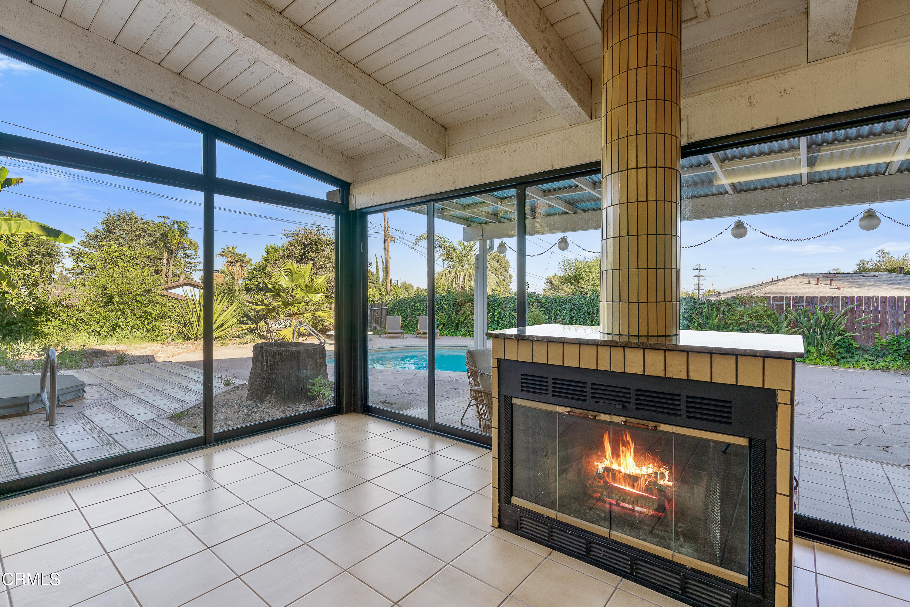 646 Spring Point Drive Bradbury, CA 91008 - Photo 12 of 26 a living room with a fireplace and a floor to ceiling window