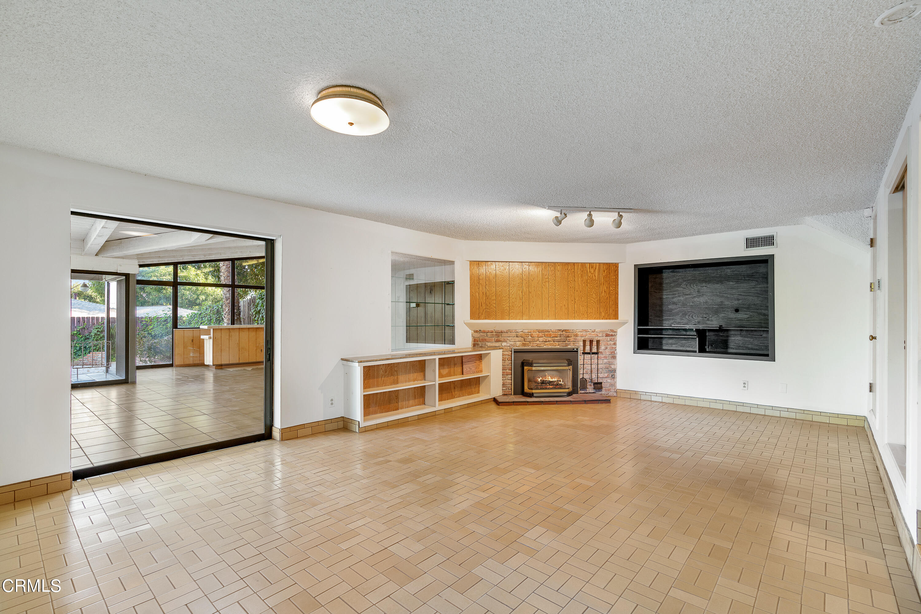 646 Spring Point Drive Bradbury, CA 91008 - Photo 14 of 26 an empty room with furniture and a fireplace