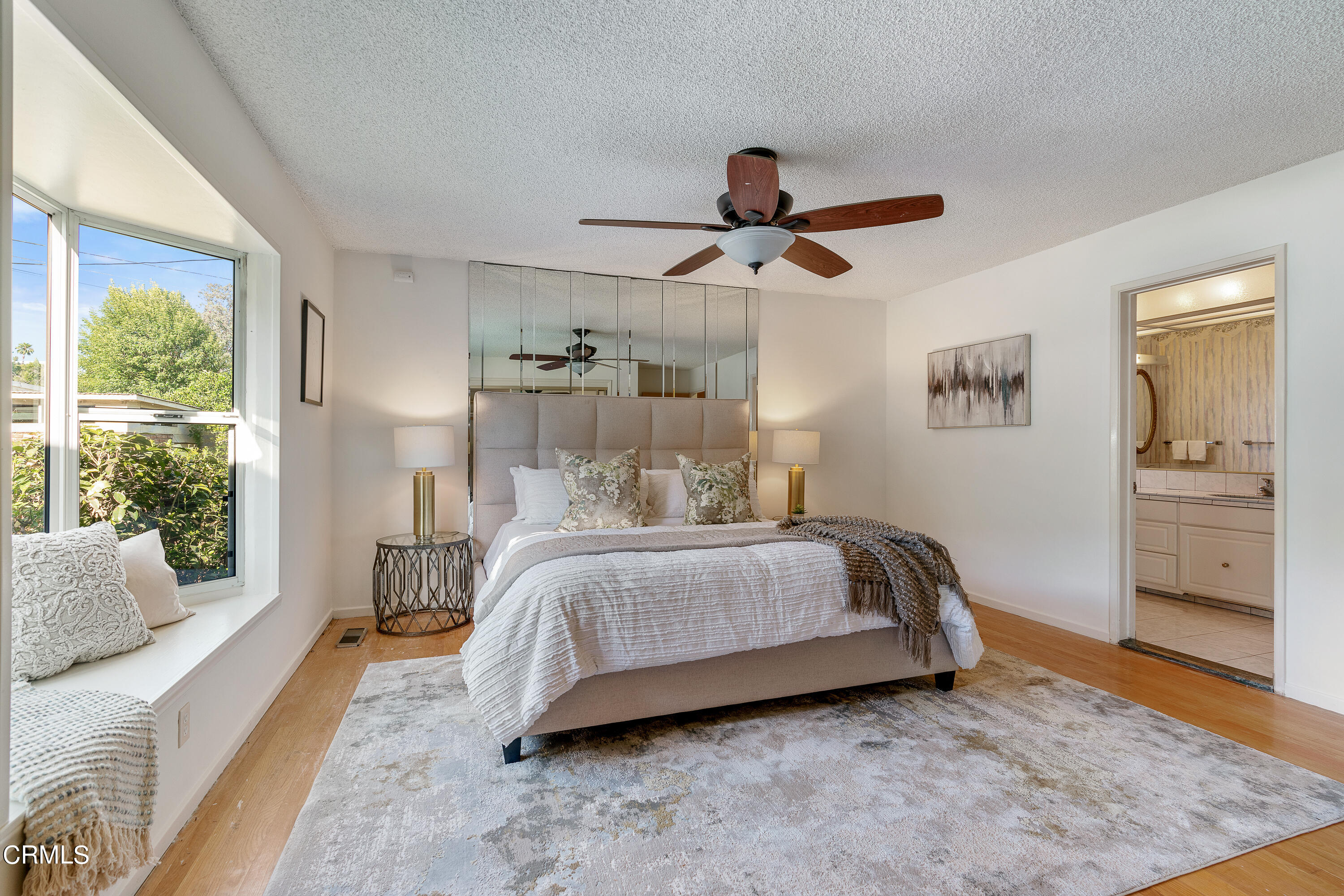 646 Spring Point Drive Bradbury, CA 91008 - Photo 17 of 26 a spacious bedroom with a bed a couch and large window