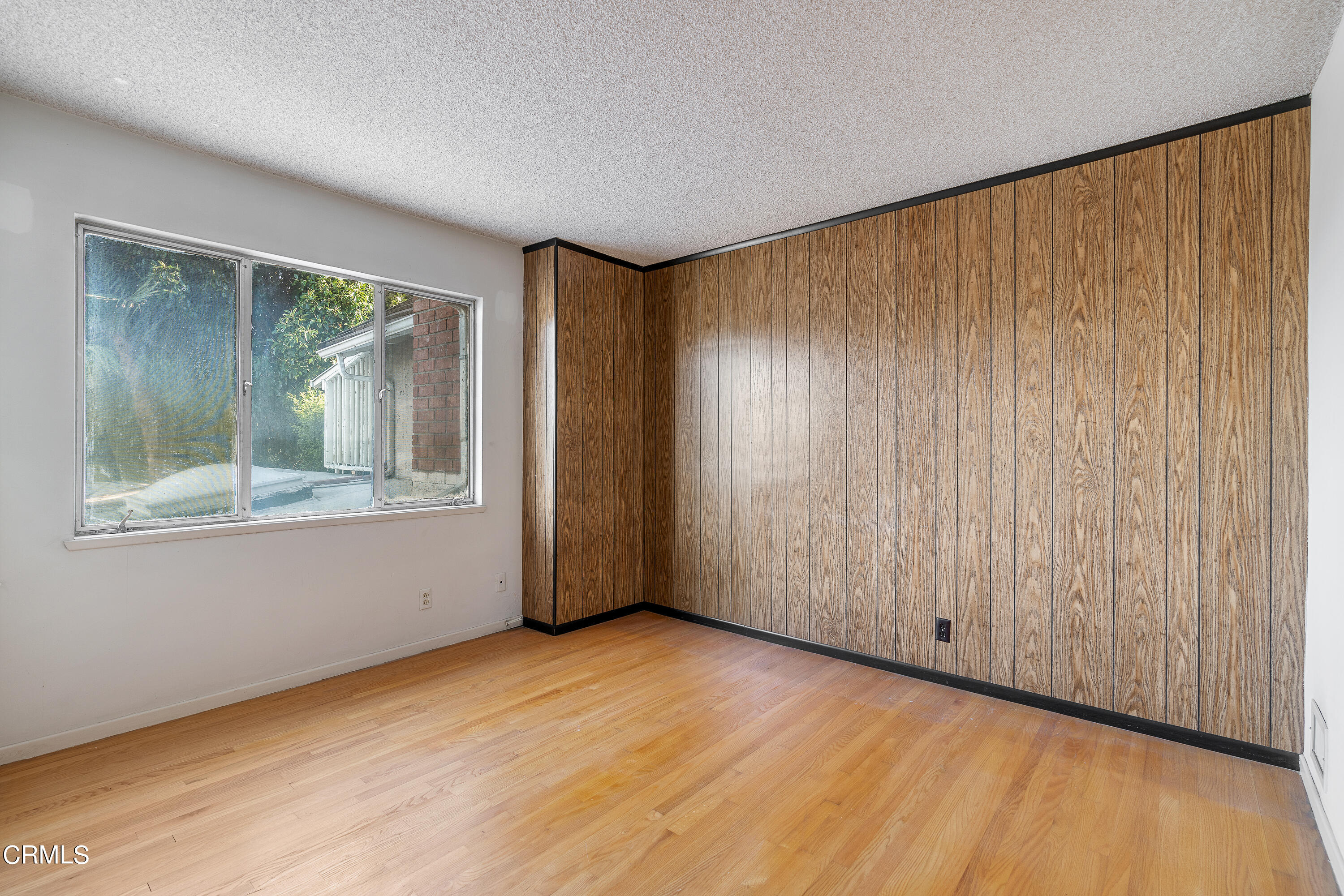 646 Spring Point Drive Bradbury, CA 91008 - Photo 21 of 26 an empty room with wooden floor and windows