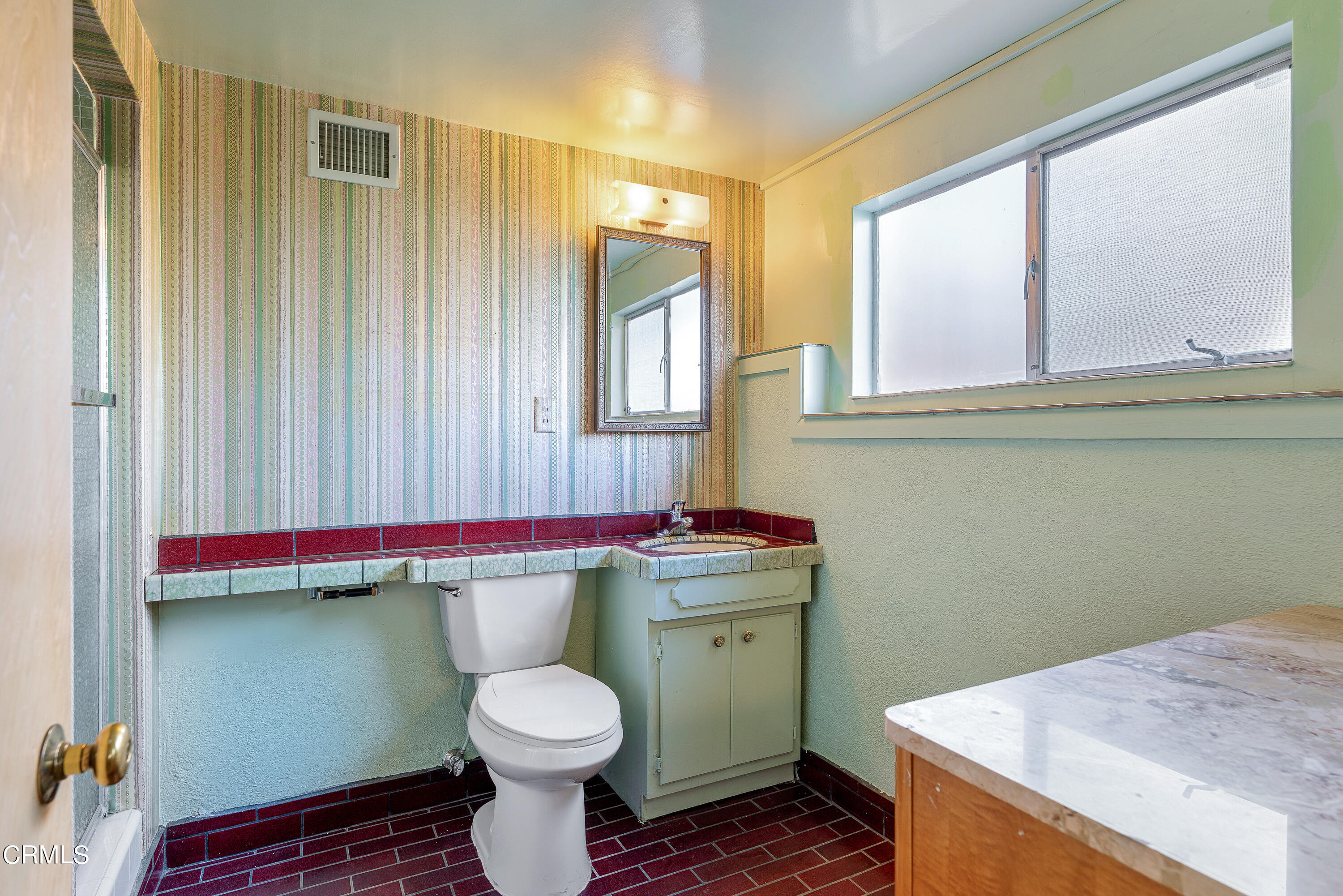 646 Spring Point Drive Bradbury, CA 91008 - Photo 22 of 26 a bathroom with a toilet sink and window