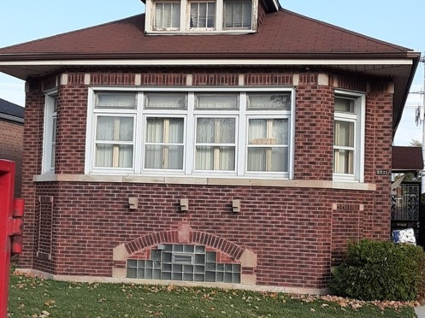 Undisclosed Address Chicago, IL 60620 - Photo 2 of 16 a front view of a building with a garden