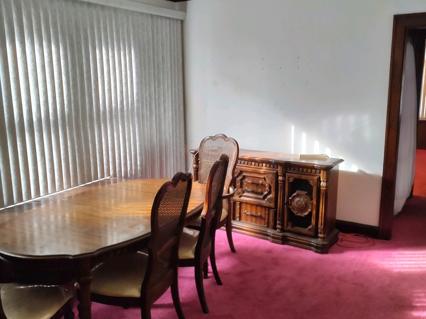 Undisclosed Address Chicago, IL 60620 - Photo 5 of 16 a view of a dining room with furniture and a fireplace
