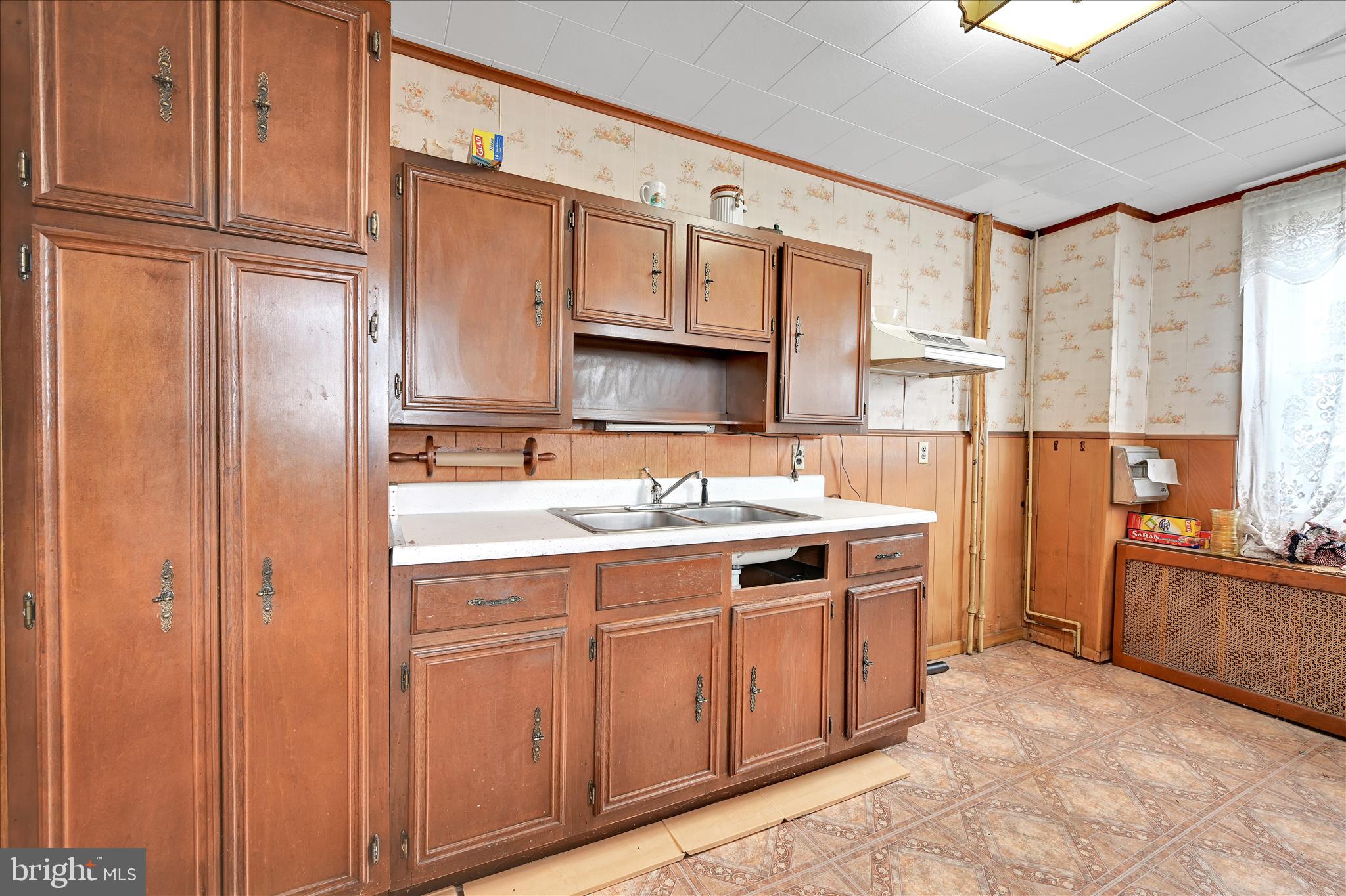 1501 Centre Street Ashland, PA 17921 - Photo 11 of 29 a kitchen with a sink stove and cabinets