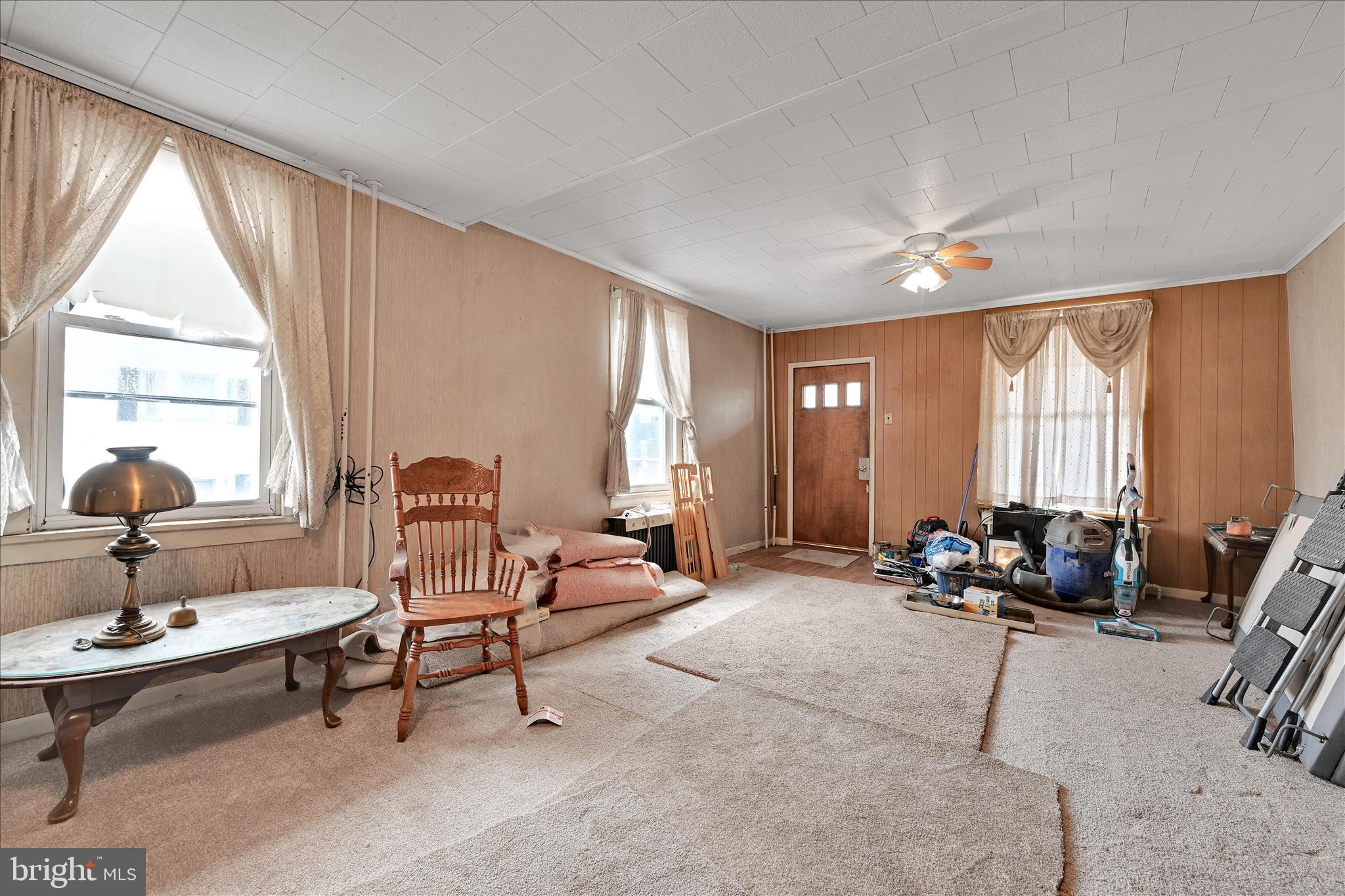 1501 Centre Street Ashland, PA 17921 - Photo 7 of 29 a living room with furniture a large window and a chandelier