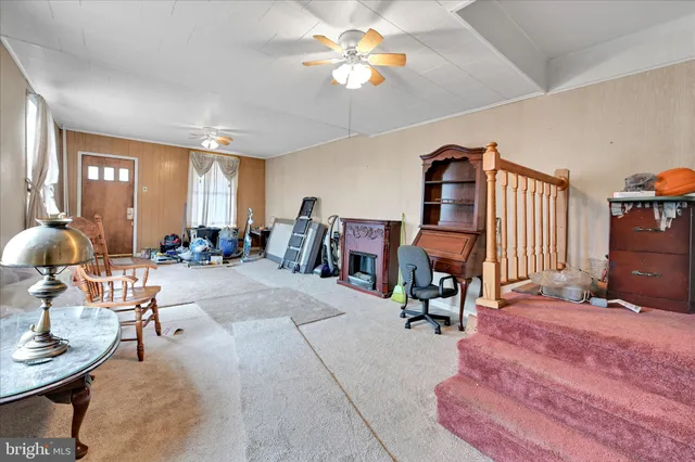 a bedroom with a table and chairs