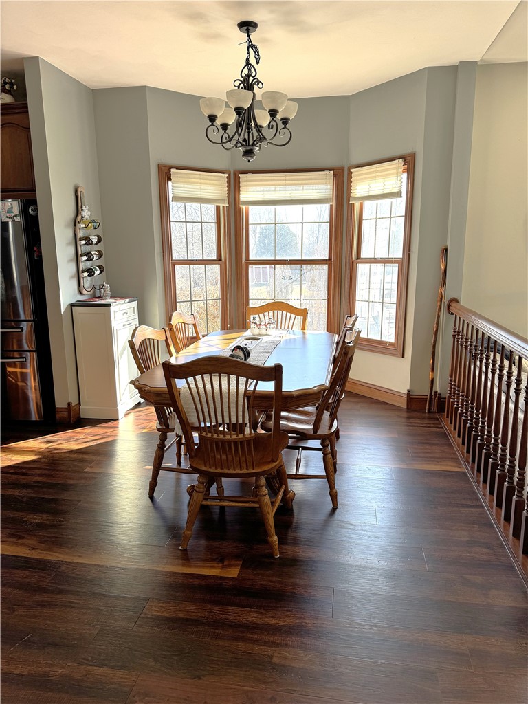 10160 Lochard Road Sidney, OH 45365 - Photo 12 of 41 This inviting dining area features ample natural light and durable flooring, perfect for everyday meals.