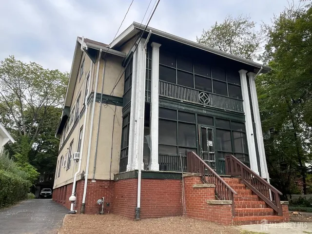 a house with trees in front of it