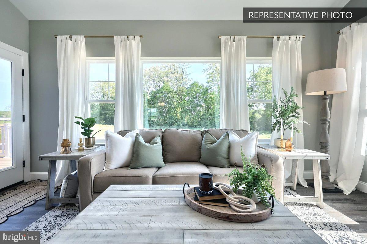 Copper Beech Plan At Seiders Hill Pottsville, PA 17901 - Photo 11 of 19 a living room with furniture and a large window