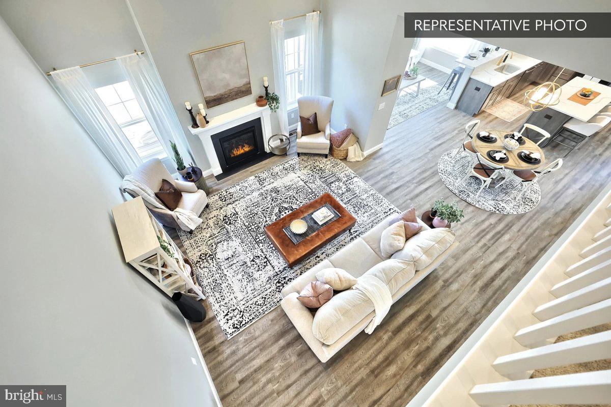 Copper Beech Plan At Seiders Hill Pottsville, PA 17901 - Photo 15 of 19 a living room with furniture and a fireplace