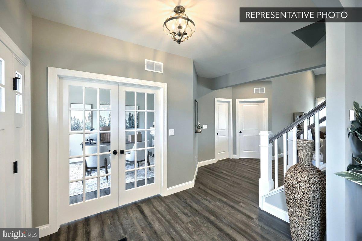Copper Beech Plan At Seiders Hill Pottsville, PA 17901 - Photo 3 of 19 a view of a hallway with wooden floor and staircase