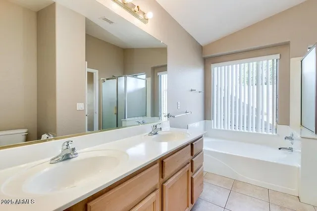 a bathroom with a bathtub and a sink