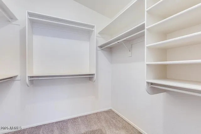 a view of an empty walk in closet