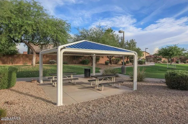 a patio with a yard table and chairs