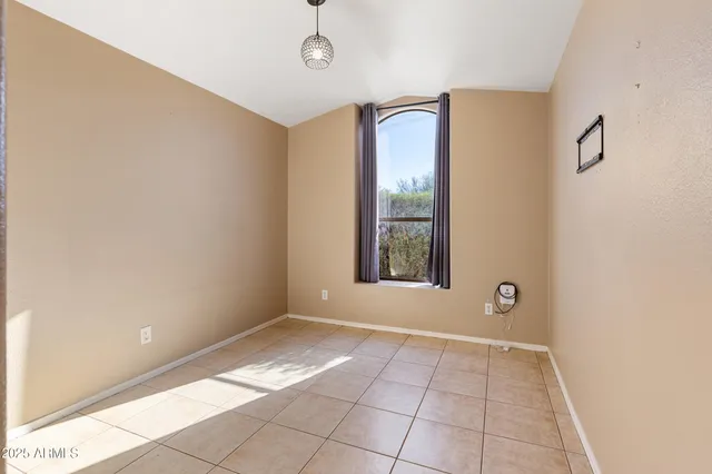 a bathroom with a sink a toilet a mirror and shower curtain