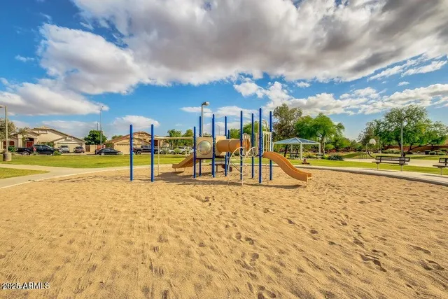 a view of a playground with basketball court