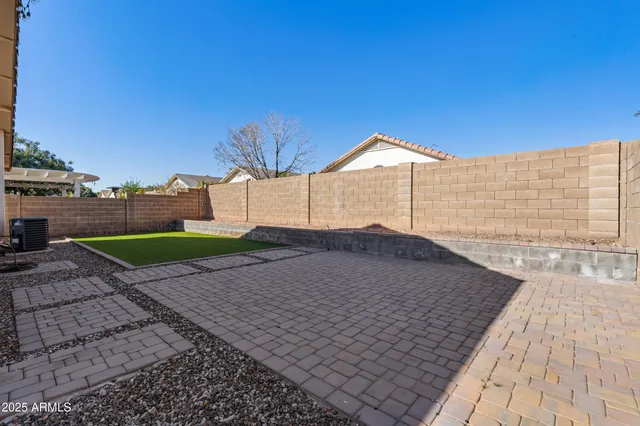 a backyard of a house with seating space