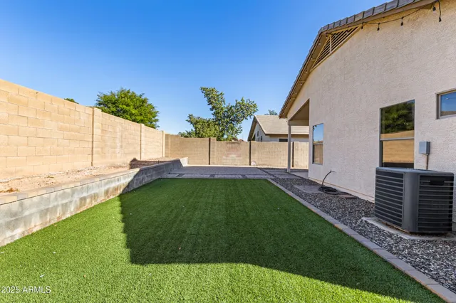 a view of a yard with swimming pool