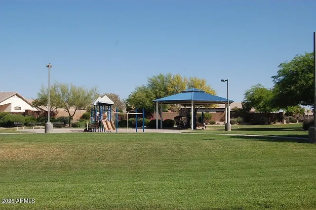 a view of a playground with basketball court