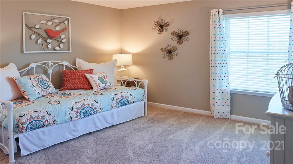 404 Misty Law Lane Clover, SC 29710 - Photo 23 of 48 a bedroom with a bed and a painting on the wall