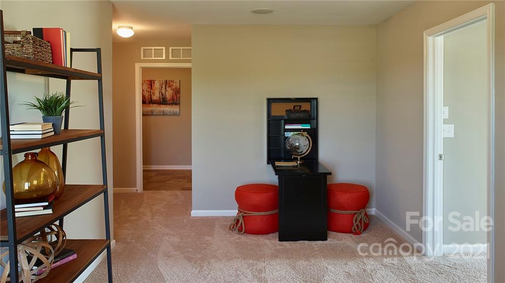 404 Misty Law Lane Clover, SC 29710 - Photo 38 of 48 a living room with furniture a rug and a wooden floor