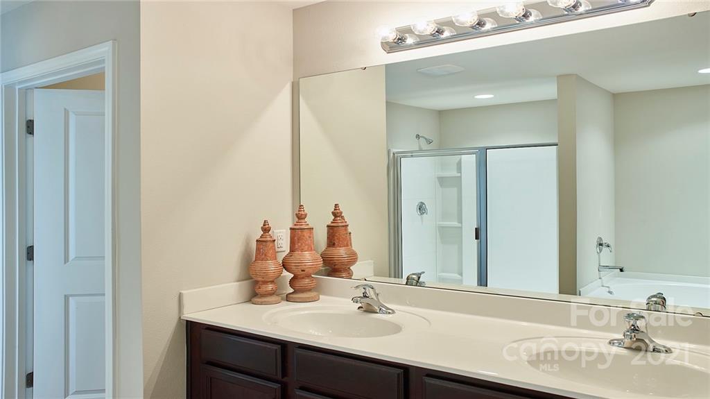 404 Misty Law Lane Clover, SC 29710 - Photo 40 of 48 a bathroom with a sink vanity and a mirror