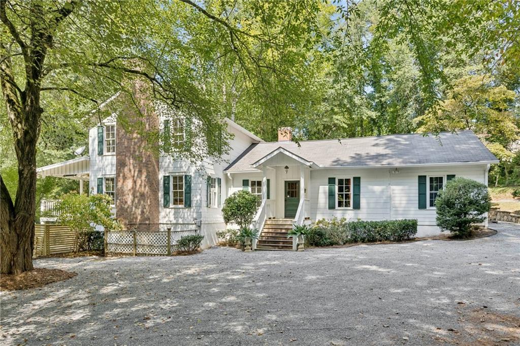 4019 Wesley Chapel Road Marietta, GA 30062 - Photo 1 of 1 a front view of a house with a yard