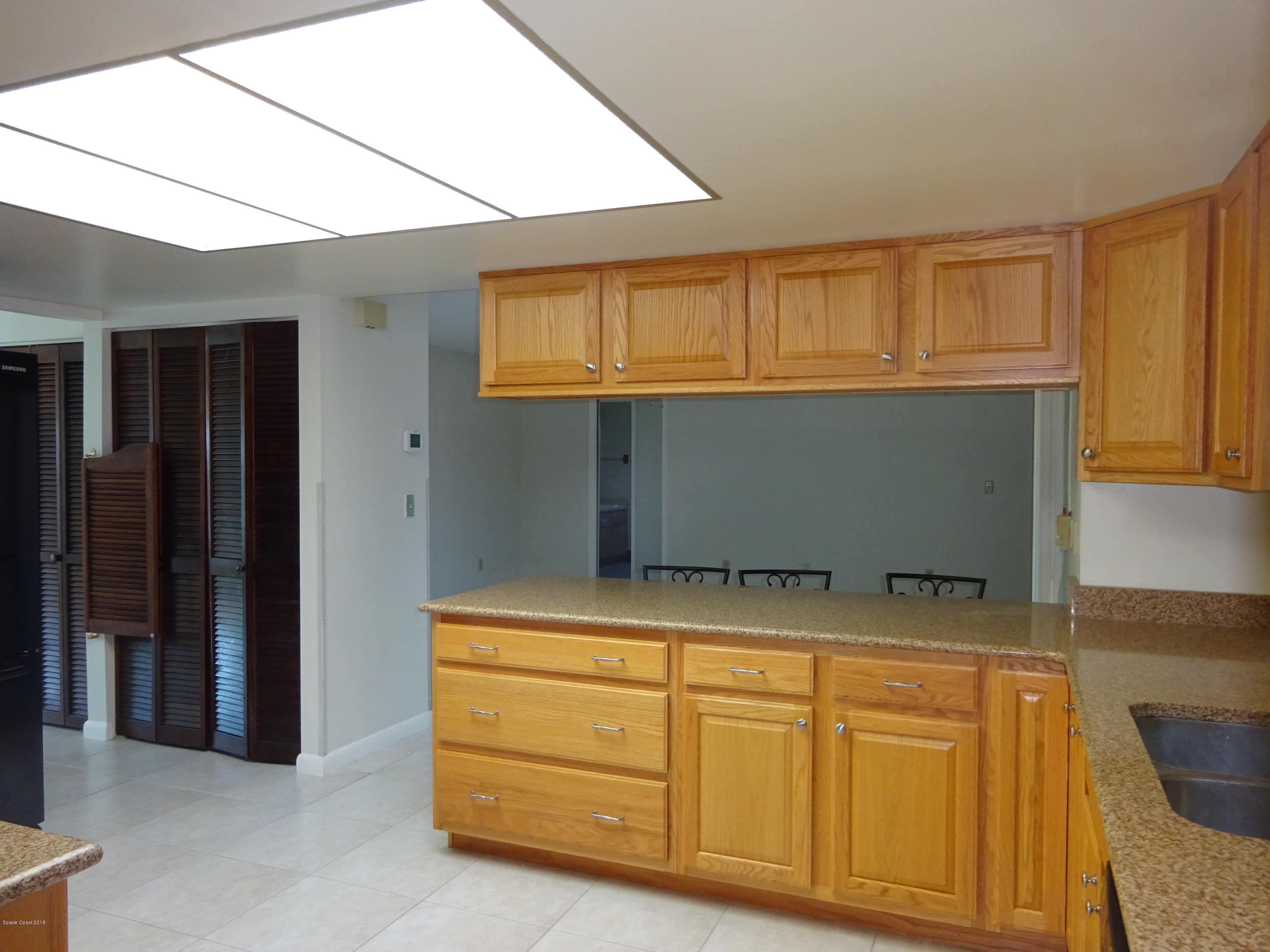 2020 Tallridge Road Melbourne, FL 32935 - Photo 5 of 31 Kitchen to Family room