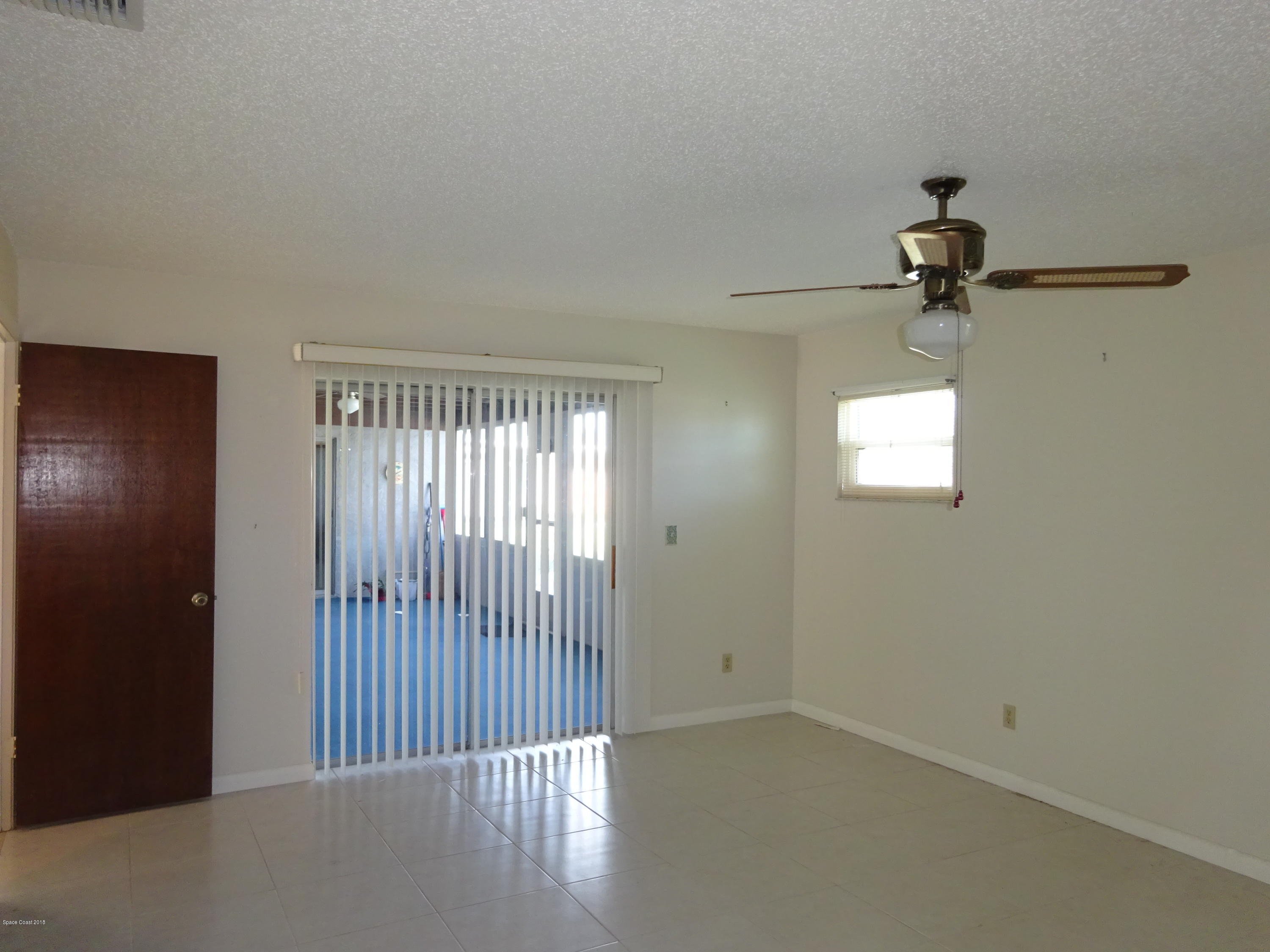 2020 Tallridge Road Melbourne, FL 32935 - Photo 8 of 31 Master with Sliders to Porch