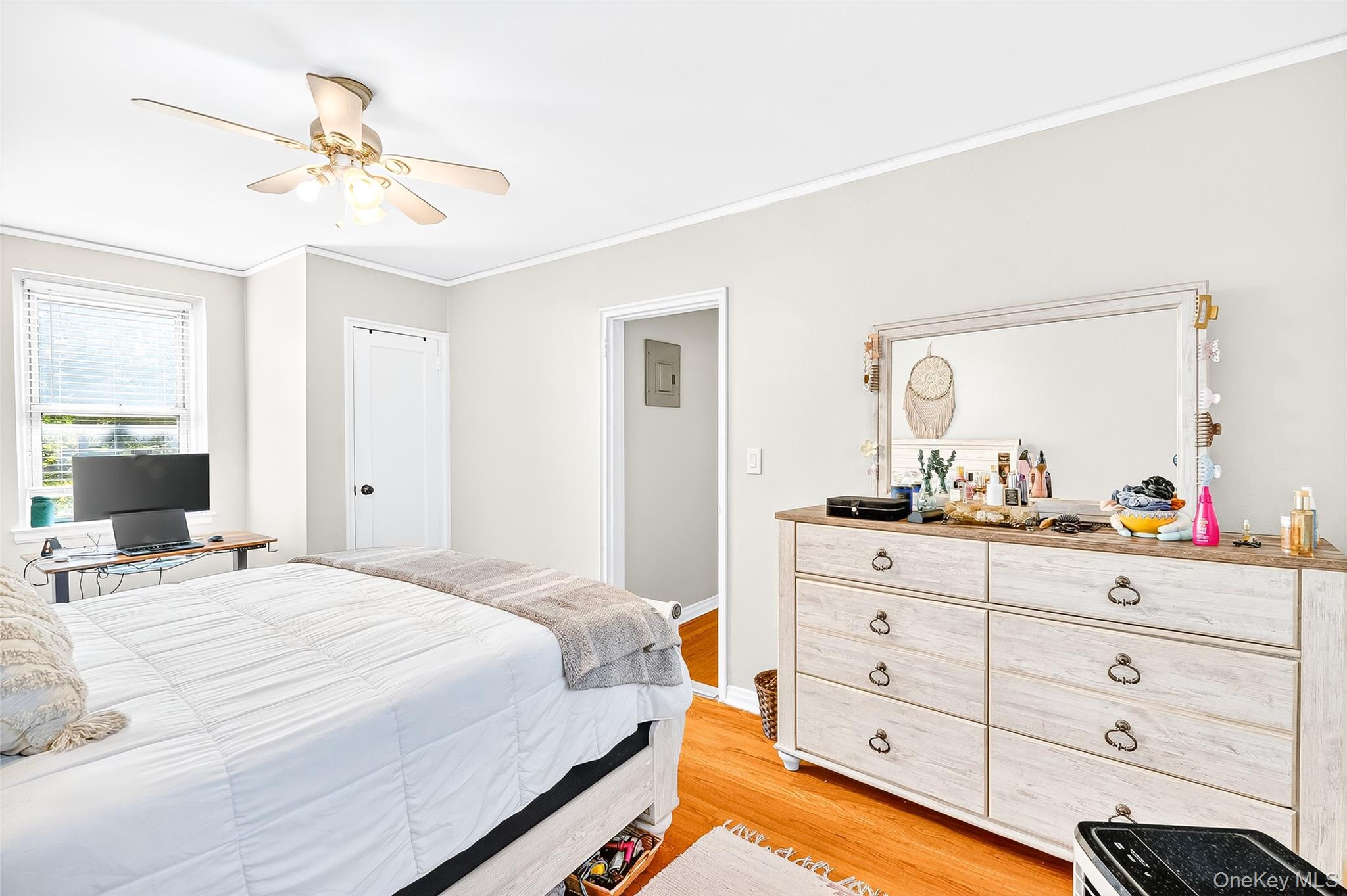 821 Bronx River Road, Unit 5J Bronxville, NY 10708 - Photo 21 of 30 a bedroom with a bed and a chandelier
