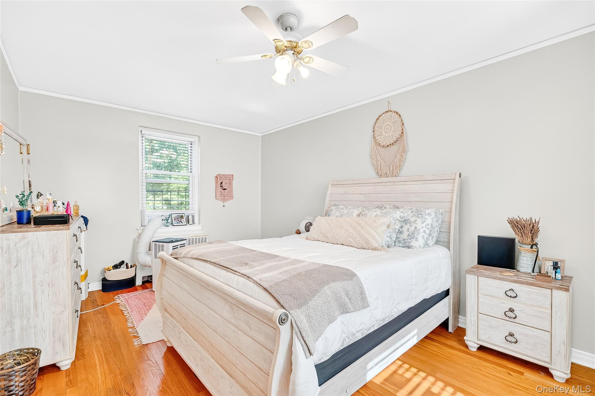 821 Bronx River Road, Unit 5J Bronxville, NY 10708 - Photo 22 of 30 a bedroom with a bed and a chandelier