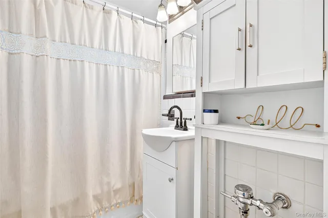 a kitchen with stainless steel appliances cabinets a sink and a window