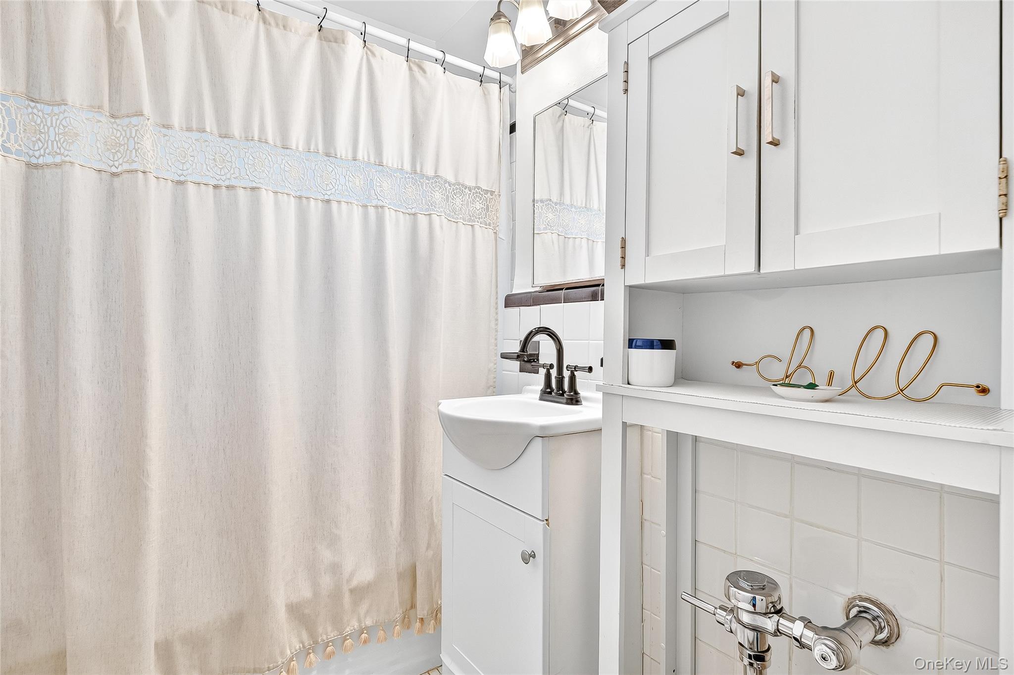 821 Bronx River Road, Unit 5J Bronxville, NY 10708 - Photo 25 of 30 a kitchen with stainless steel appliances cabinets a sink and a window
