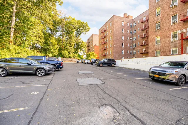 a view of a cars parked in front of a building