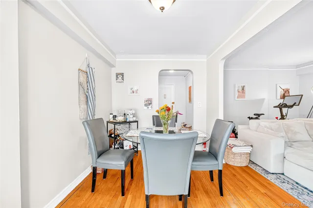 a view of a dining room with furniture and wooden floor