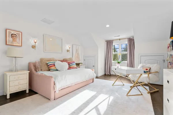 a bedroom with a bed and a table in it