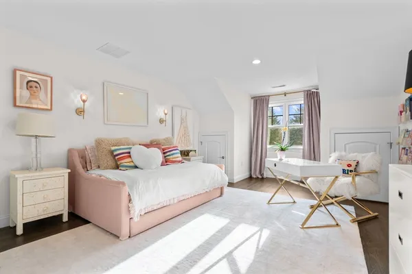 a bedroom with a bed and a table in it