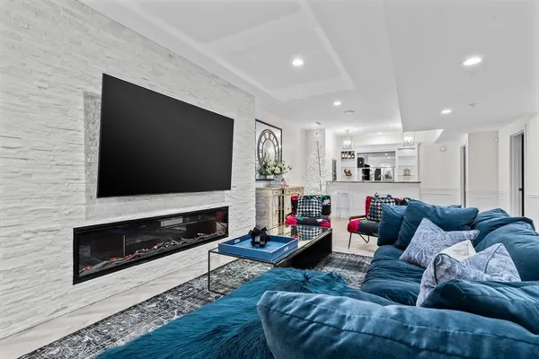 a kitchen with stainless steel appliances kitchen island granite countertop a table and chairs in it