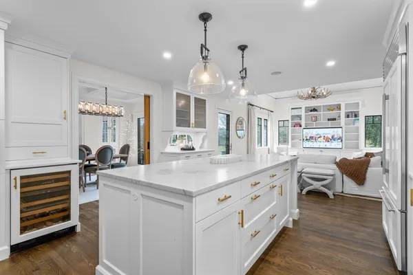 a kitchen with stainless steel appliances kitchen island granite countertop a sink and cabinets