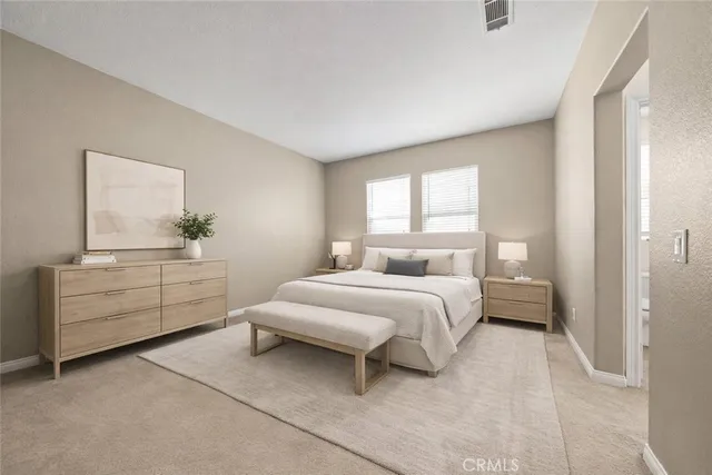 a bedroom with a bed and a dresser