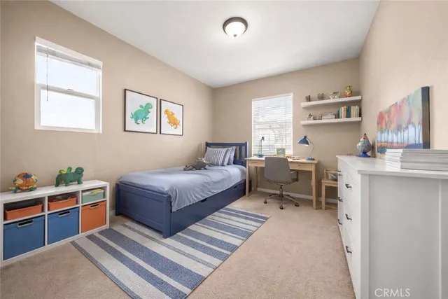 a bedroom with a bed and a book shelf