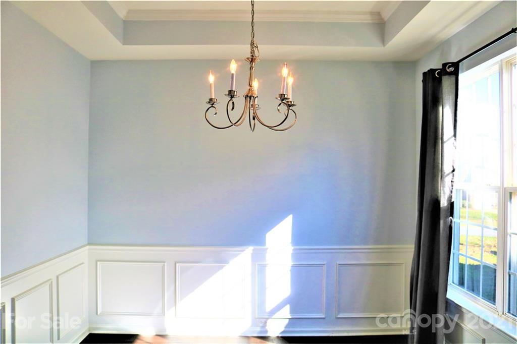 3234 Queensland Court Indian Land, SC 29707 - Photo 14 of 35 a view of a room with wooden floor and windows