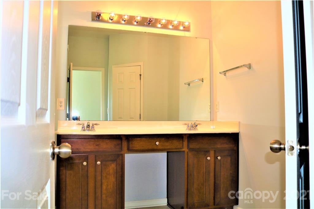 3234 Queensland Court Indian Land, SC 29707 - Photo 22 of 35 a bathroom with a sink and a mirror